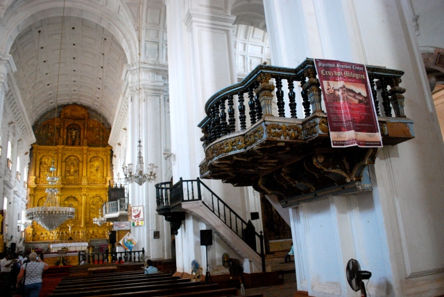 The gold-leafed altar panels depicting St. Catherine's life and death, the chandelier under which St. Francis Xavier's  relics are placed, and the private box for the nobility all in St. Catherine's Cathedral in Old Goa, India.